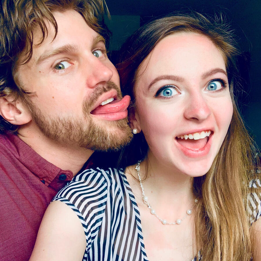 Diana and Damien making goofy faces in a close-up selfie