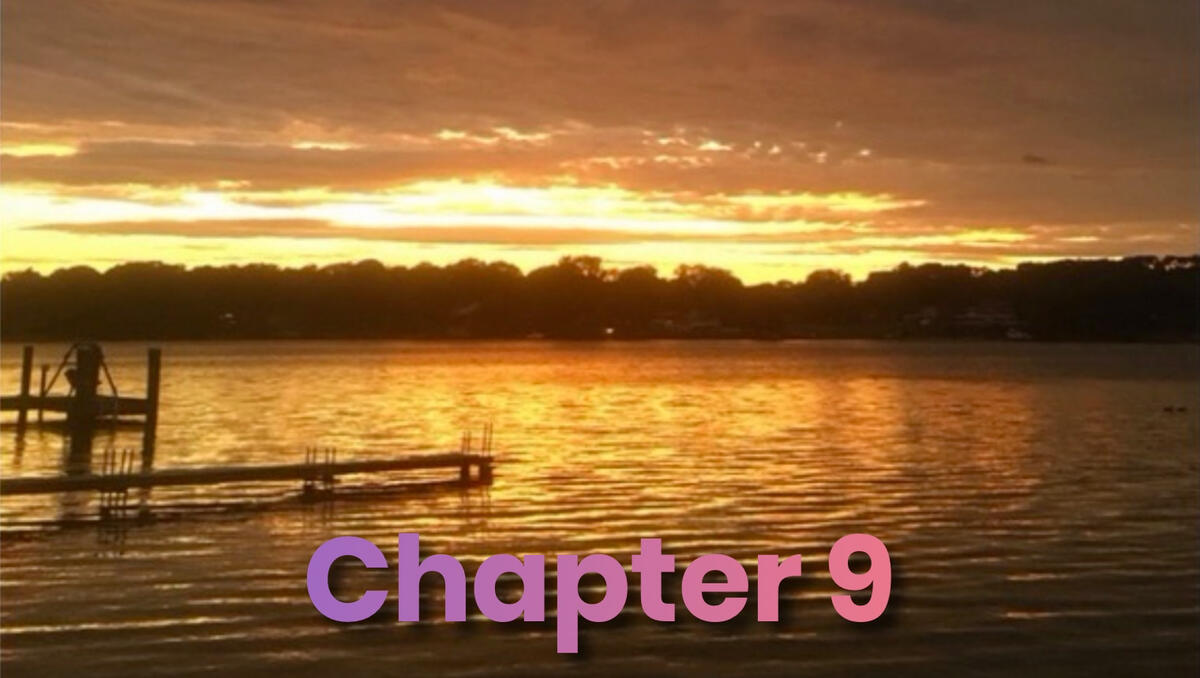 A landscape photo of a lake at sunset with a dock jutting into the water.