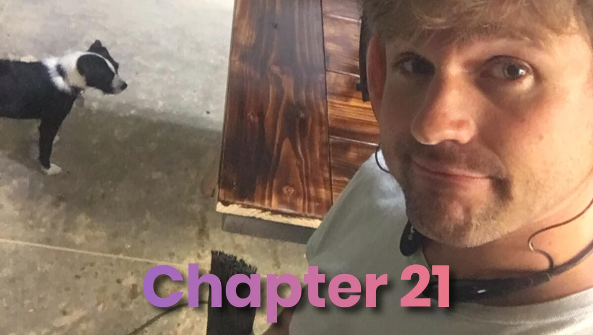 Damien works in the shop, building a farmhouse table, with his dog, Maevey.